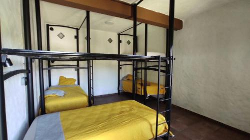Cama o camas de una habitación en Hostal Maria Tepozteca