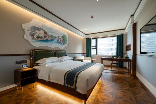 A bed or beds in a room at Nostalgia S Hotel Shanghai Railway Station