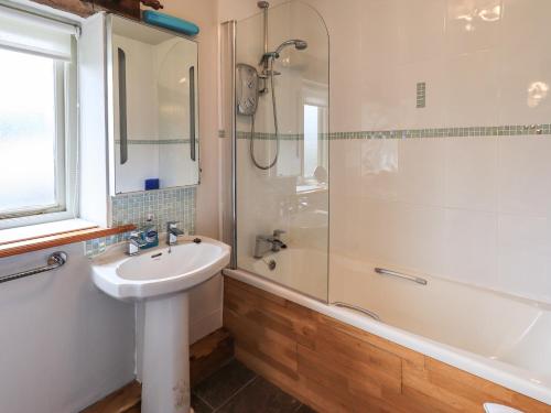 a bathroom with a sink and a shower at Tullythwaite Garth in Crosthwaite