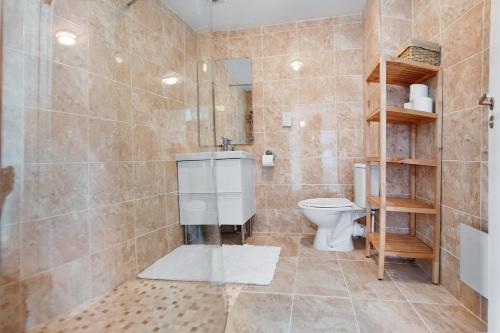 a bathroom with a toilet and a sink and a shower at Thistle Apartments - Rose Apartment in Aberdeen