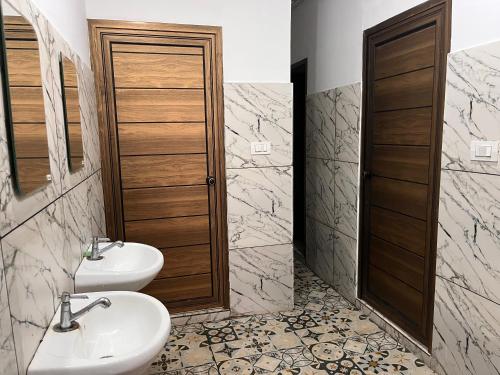 Vonios kambarys apgyvendinimo įstaigoje TCS Rooms Ezhilode Payyanur
