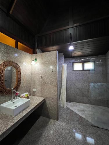 a bathroom with a sink and a shower at Sasitara Thai Villas in Choeng Mon Beach