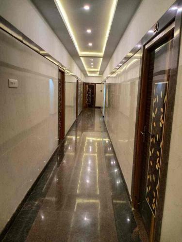 a hallway of a building with a long corridor at KJR Residency&Rooms in Chennai