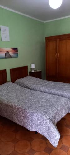 Ένα ή περισσότερα κρεβάτια σε δωμάτιο στο Casa zia Lidia