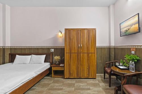 Postel nebo postele na pokoji v ubytování Mộc Nhiên Hotel Da Nang