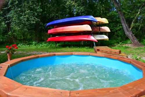 a large pool of water with a group of umbrellas at Akmeninė Sala in Šventoji