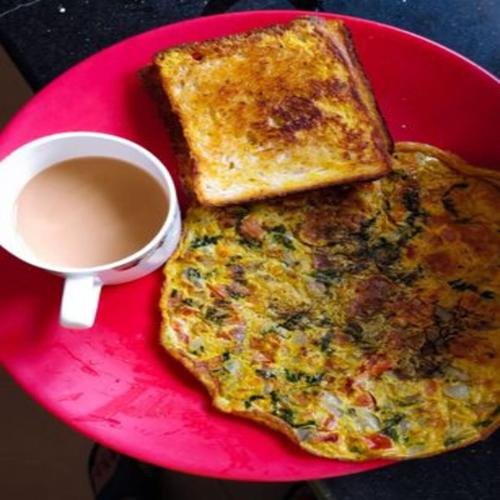 a pink plate with two slices of toast and a cup of coffee at Hotel Heritage - Near Trade Center, Visa Consulate BKC in Mumbai