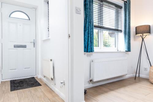a room with a white door and a window at Marham Close in Nottingham