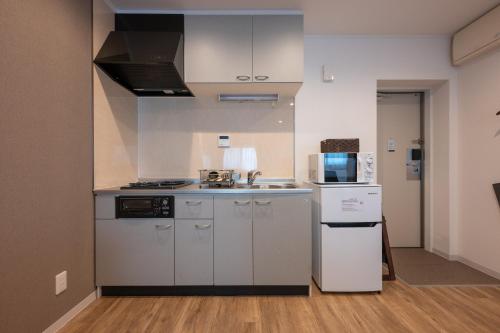 Η κουζίνα ή μικρή κουζίνα στο HOTEL R9 The Yard Ashikagafukutomi