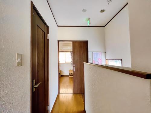 an empty room with a hallway with a door at 千間川-緑橋 in Osaka