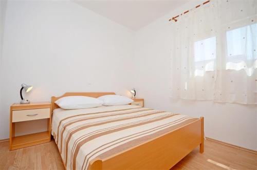 En eller flere senger på et rom på Apartments Pisac