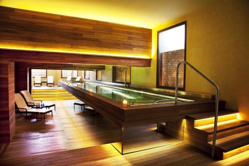 a large swimming pool in a room with at URSO Hotel & Spa, a Small Luxury Hotel of the World in Madrid