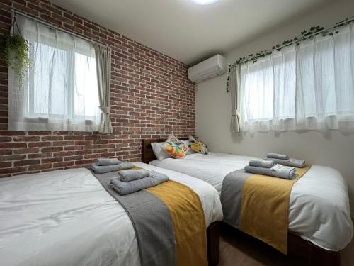 Säng eller sängar i ett rum på nestay villa tokyo oyama