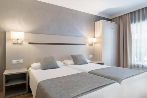  Hotel & Aparthotel Cosmos -  Room  picture :   Bath    Safety deposit box    TV                           