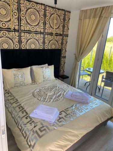 Postel nebo postele na pokoji v ubytování MMA apartament