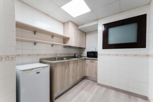 Kuchyň nebo kuchyňský kout v ubytování Hotel & Aparthotel Cosmos