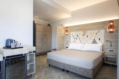 Lu' Hotel Carboniaにあるベッド