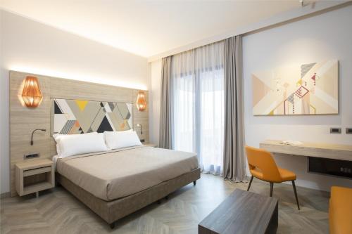 En eller flere senge i et værelse på Lu' Hotel Carbonia