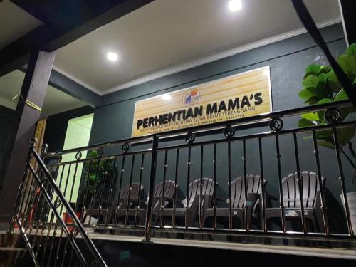 a group of chairs sitting on a balcony at Perhentian Mama's in Perhentian Island