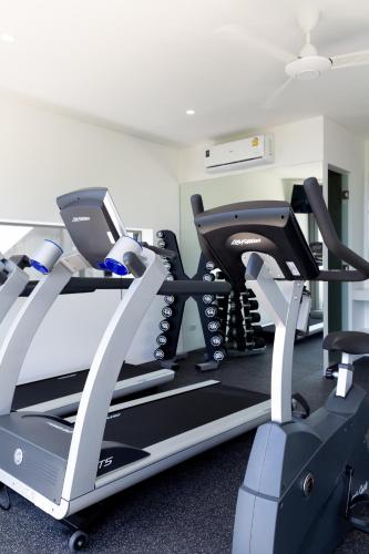 a gym with two tread machines and a treadmill at Zog Villas in Koh Samui 