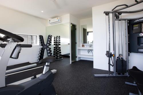 a fitness room with a gym with tread machines at Zog Villas in Koh Samui 