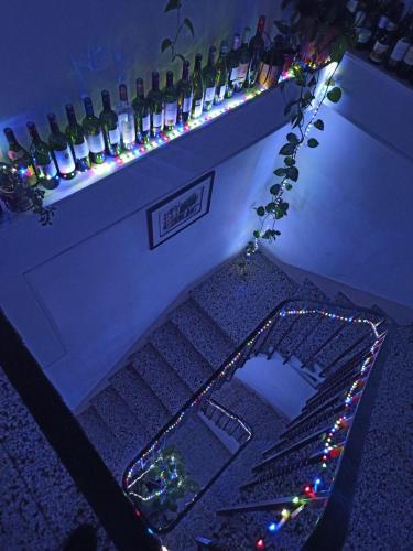 a bar with a keyboard and a bunch of wine bottles at Chateau View Chambres d'hôtes in Quillan