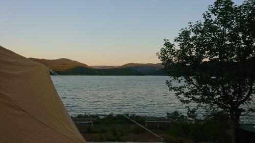 a view of a lake from a camping tent at Lakeview Glamping in Staro Myasto