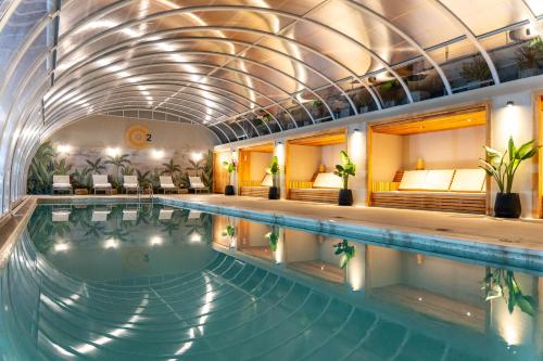 a pool in a hotel with an indoor swimming pool at O2 Hotel Mar del Plata in Mar del Plata