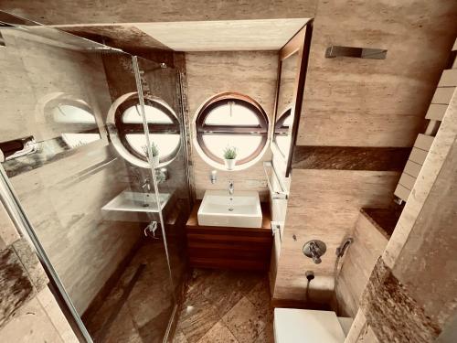 a bathroom with a sink and a mirror at Hotel Bellevue in Charzykowy