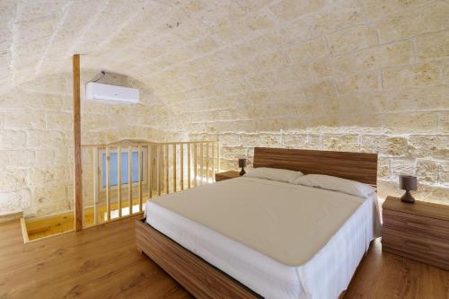 Säng eller sängar i ett rum på Scaringi Central Apartment