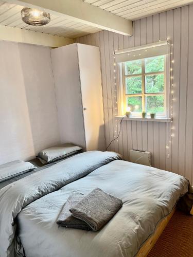 Ένα ή περισσότερα κρεβάτια σε δωμάτιο στο Cozy child-friendly house