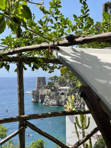 a view of the ocean and the ruins of the mayan pyramid at La Dolce Vita a Positano boutique hotel in Positano