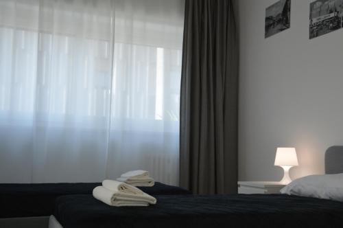 A bed or beds in a room at Quintino Sella rooms