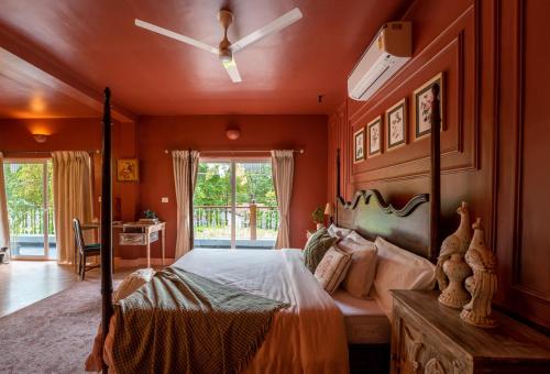 a bedroom with a bed and a ceiling fan at ELIVAAS 5 BHK with Pvt Pool, Entertainment Room & Glass House - Bludoor in Marmagao