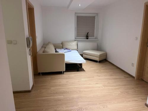 a room with a bed and a couch in it at Dom Melissa v malebnej obci Banka in Piešťany