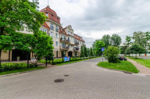 a street with a building on the side of the road at Morena in Ełk