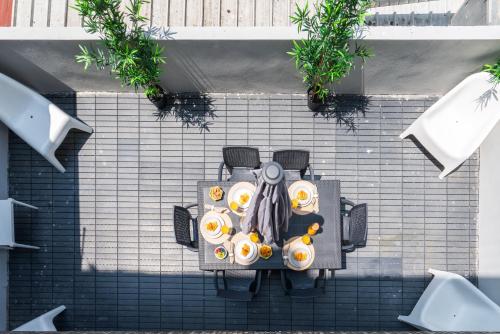 an overhead view of a table with food on it at Host Wise - Modern Flats with Stunning Terrace or Balcony - Central Location in Porto
