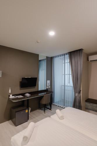 วัน บัดเจท เชียงราย เชียงแสน One Budget Hotel Chiangrai Chiangsaenにあるベッド