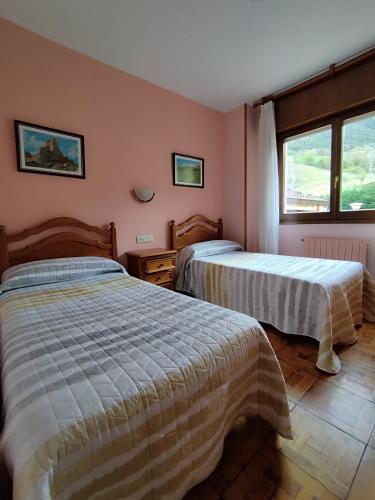 Postel nebo postele na pokoji v ubytování Hostal La Parrilla