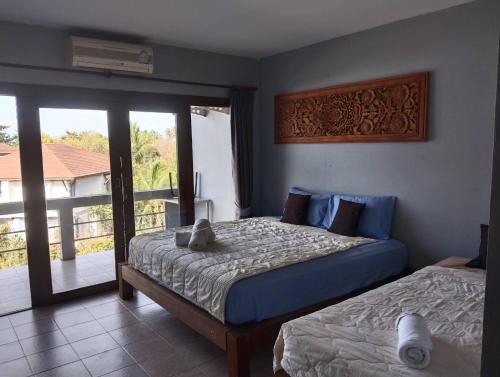 A bed or beds in a room at Fueangfu Home Hostel