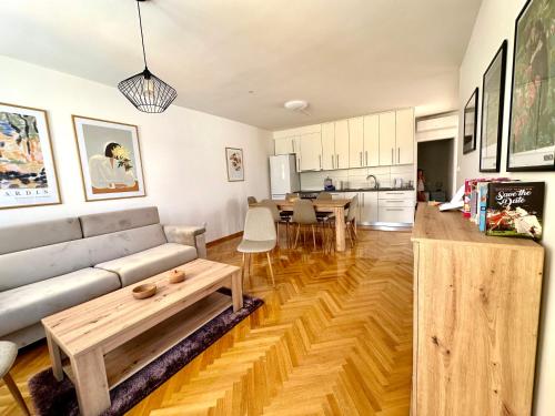 a living room with a couch and a table at Alma apartments in Mostar
