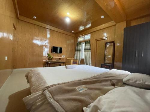 Ένα ή περισσότερα κρεβάτια σε δωμάτιο στο Sonam Guest House
