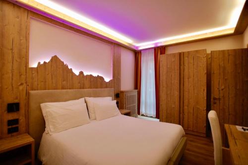 Ένα ή περισσότερα κρεβάτια σε δωμάτιο στο Hotel Cima Rosetta - BW Signature Collection