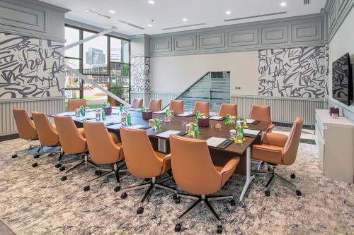 a conference room with a long table and chairs at Le Meridien Abu Dhabi Resort in Abu Dhabi