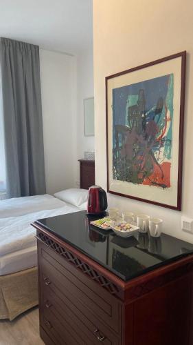 a hotel room with a desk and a bed at Aparthotel Slezák in Litomyšl