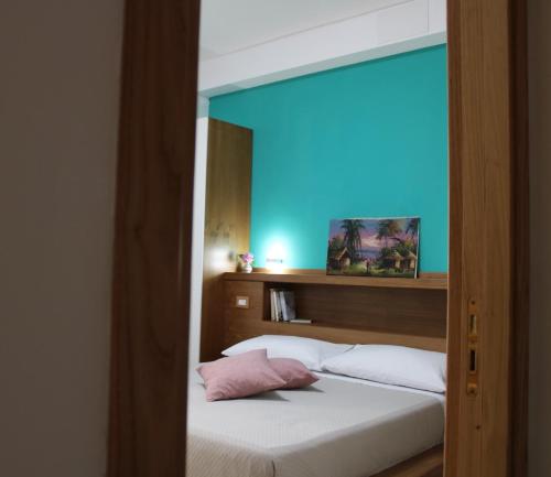 a room with a bed with a blue light at B&B Zia Bianca in Vietri sul Mare
