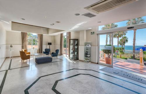 a living room with a view of the ocean at Bahía Tropical in Almuñécar