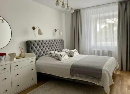 Postel nebo postele na pokoji v ubytování N-J Apartament