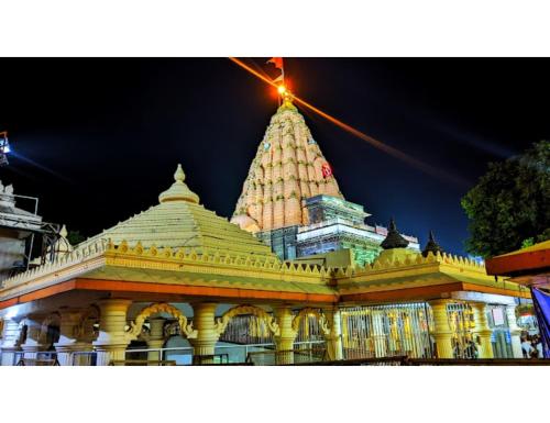 a view of a building with a large tower at Hotel Atit Villa, Ujjain in Ujjain