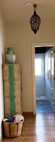 a room with a vase and a basket on the floor at APARTAMENTO PAULA in San Miguel de Abona
